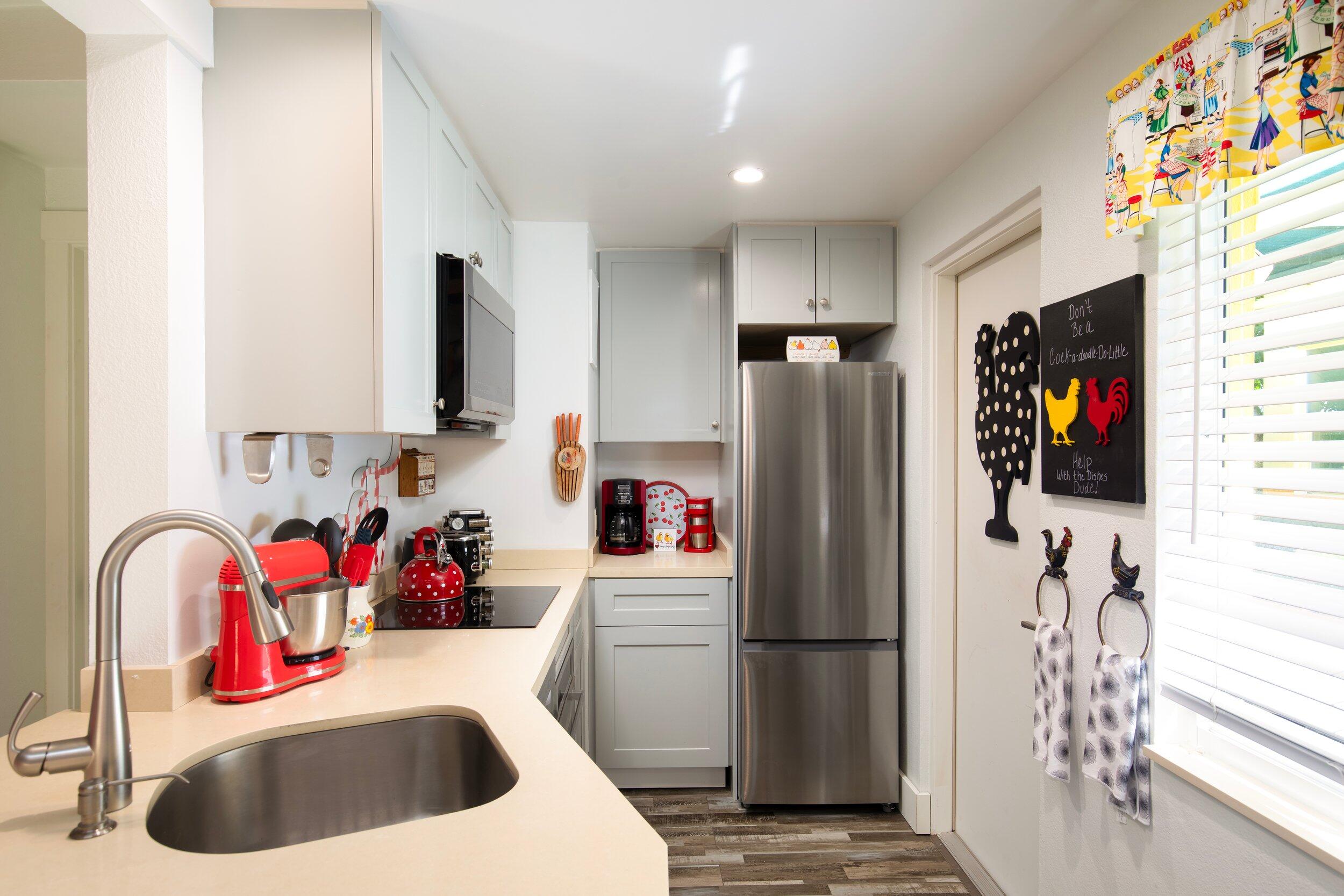 1519 Florida Street Key West, FL 33040 - Photo 73 of 86 a kitchen with stainless steel appliances a refrigerator sink and a microwave