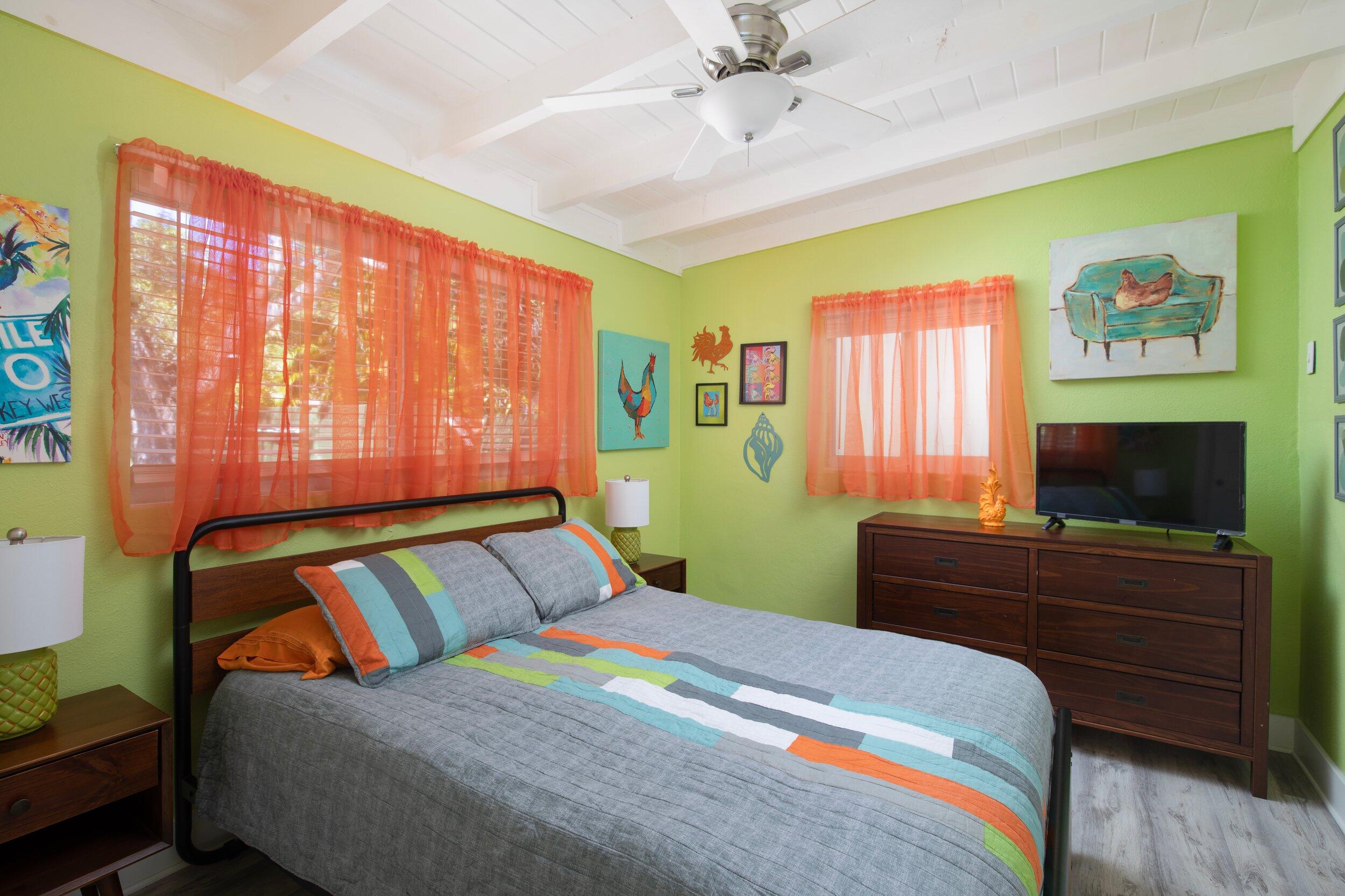1519 Florida Street Key West, FL 33040 - Photo 74 of 86 a bedroom with a bed and a flat screen tv