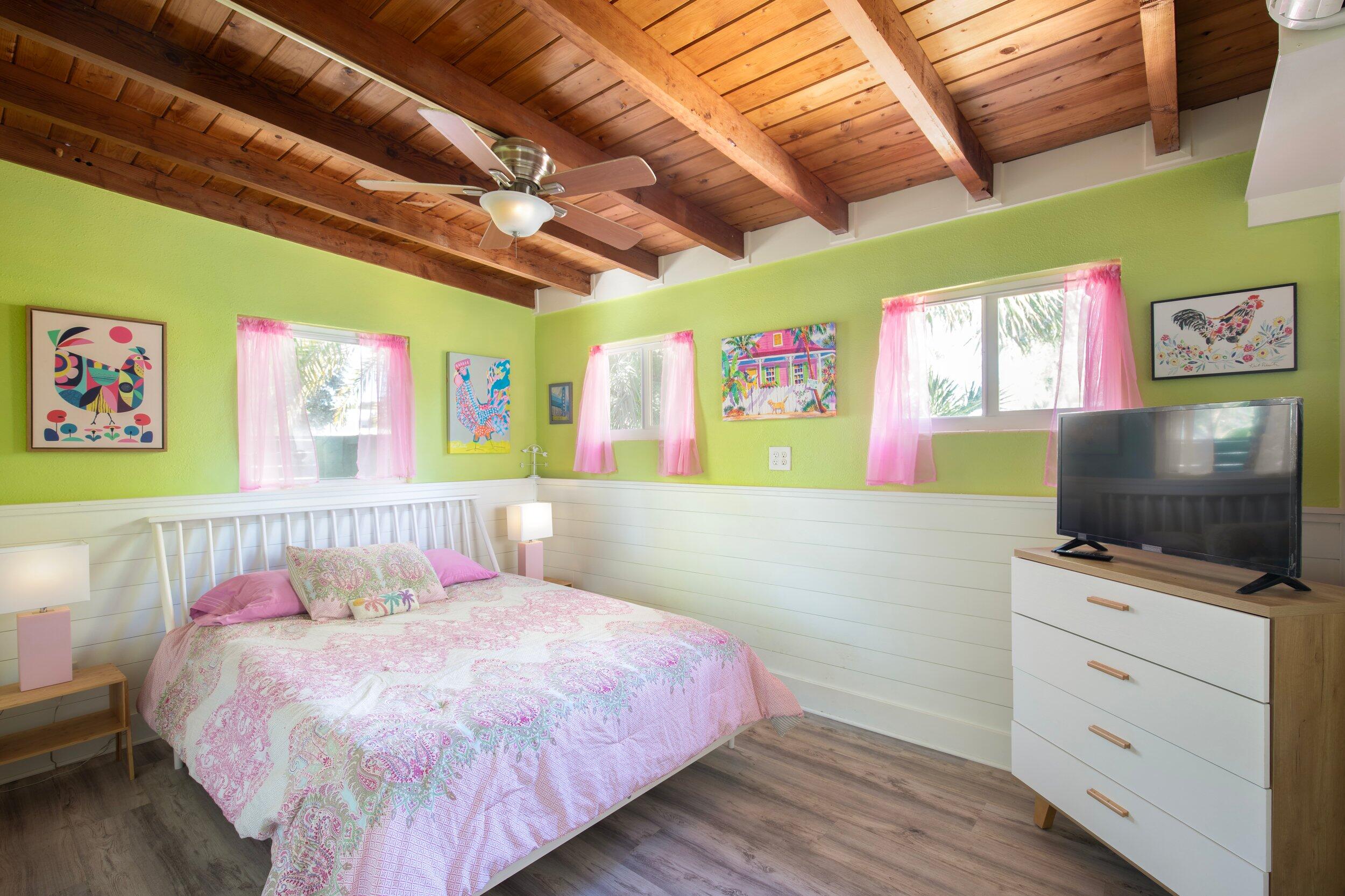 1519 Florida Street Key West, FL 33040 - Photo 78 of 86 a bedroom with a bed and a flat screen tv