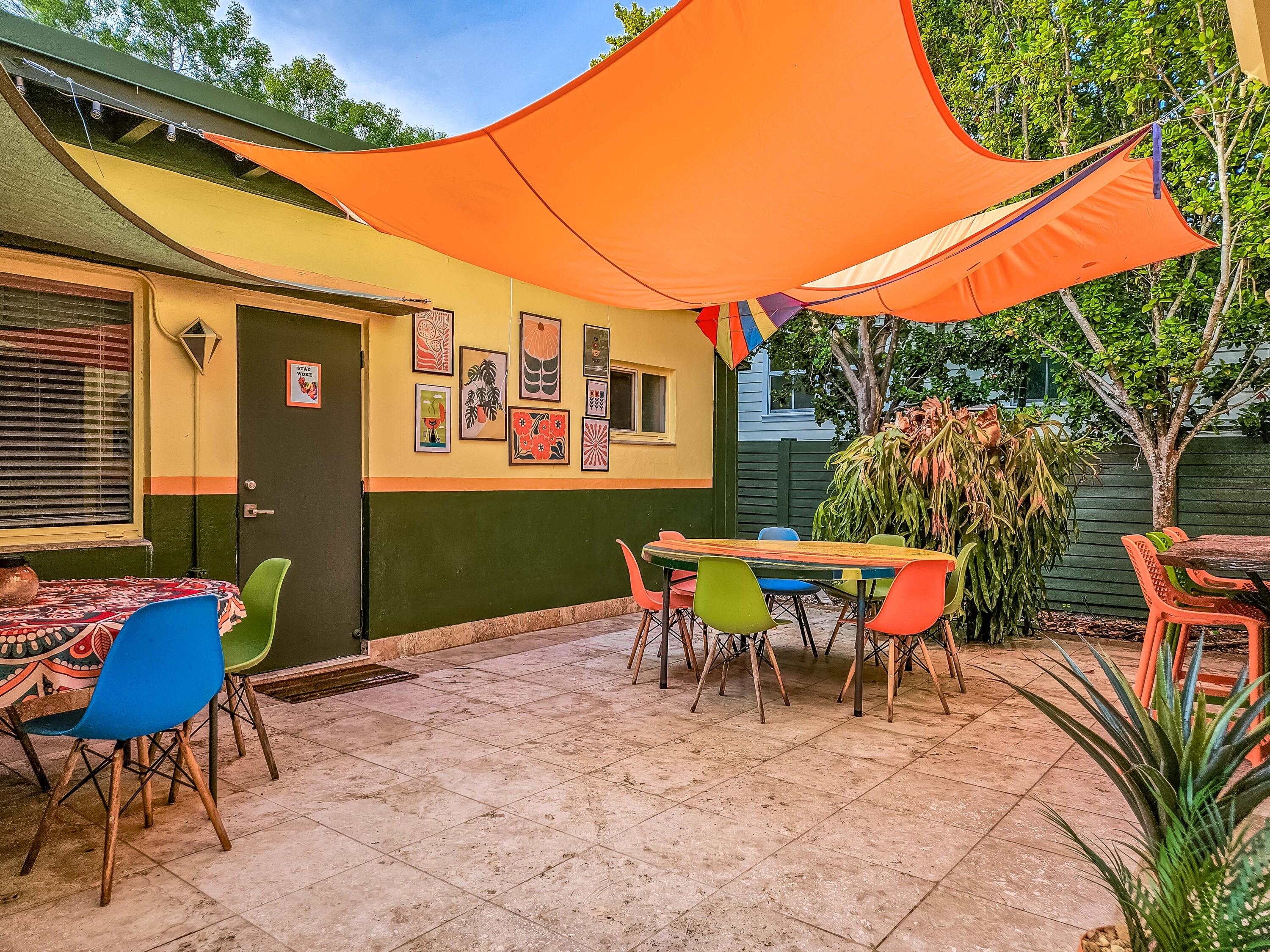 1519 Florida Street Key West, FL 33040 - Photo 80 of 86 a backyard of a house with table and chairs