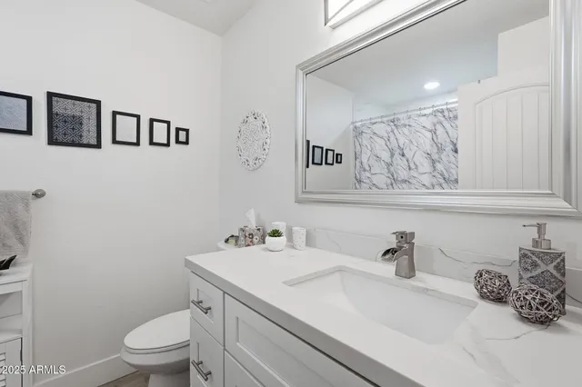 a bedroom with two beds and a window