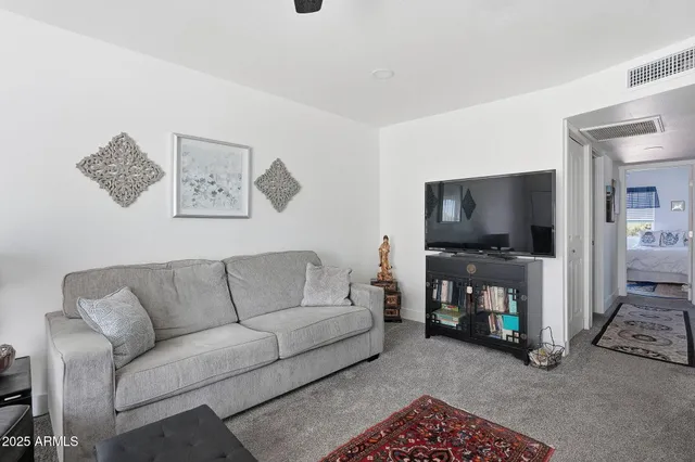 a view of kitchen with refrigerator stove dining table and chairs
