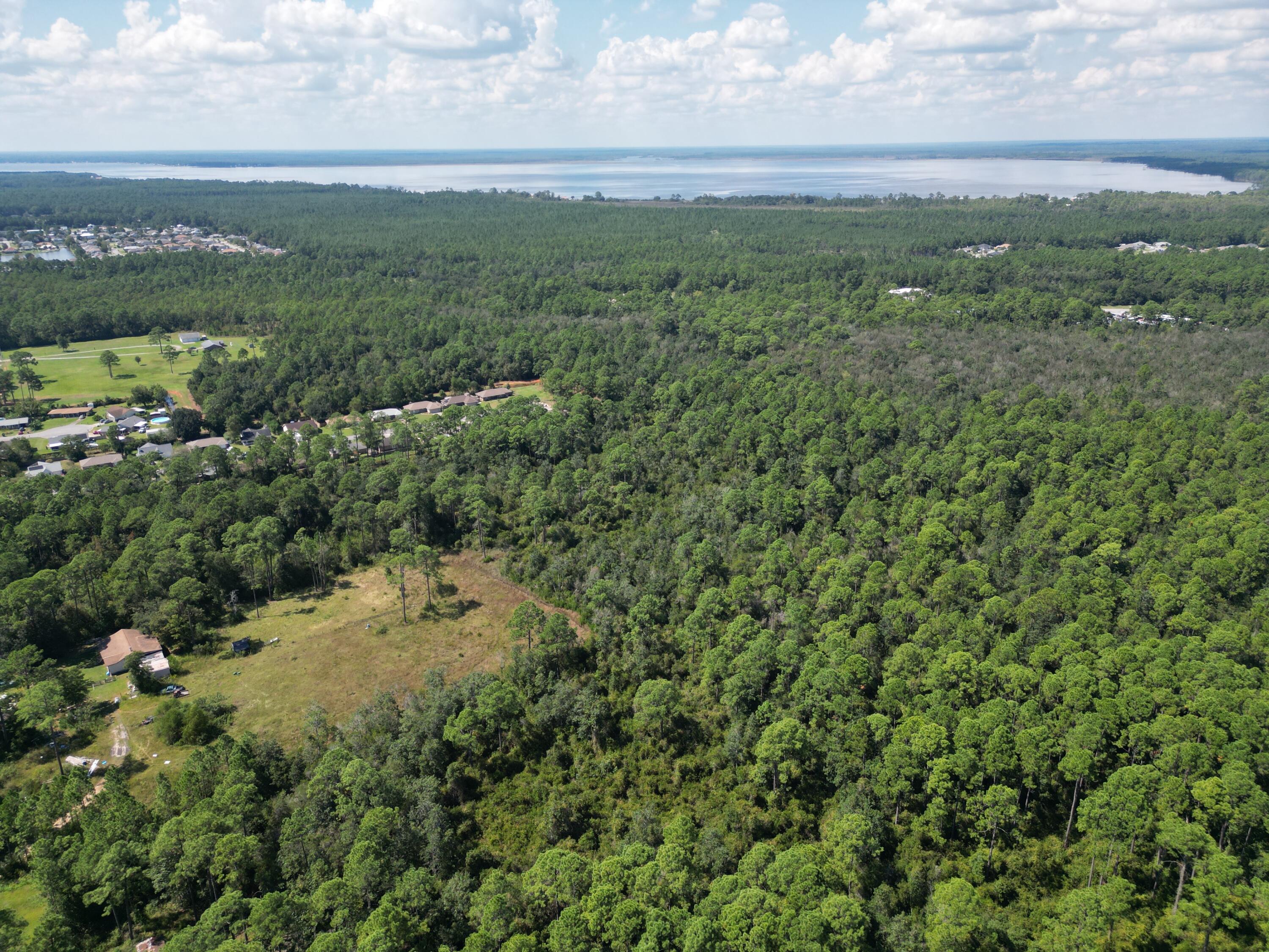 0 Mier Henry Road Pensacola, FL 32506 - Photo 4 of 20 a view of a city with lush green forest