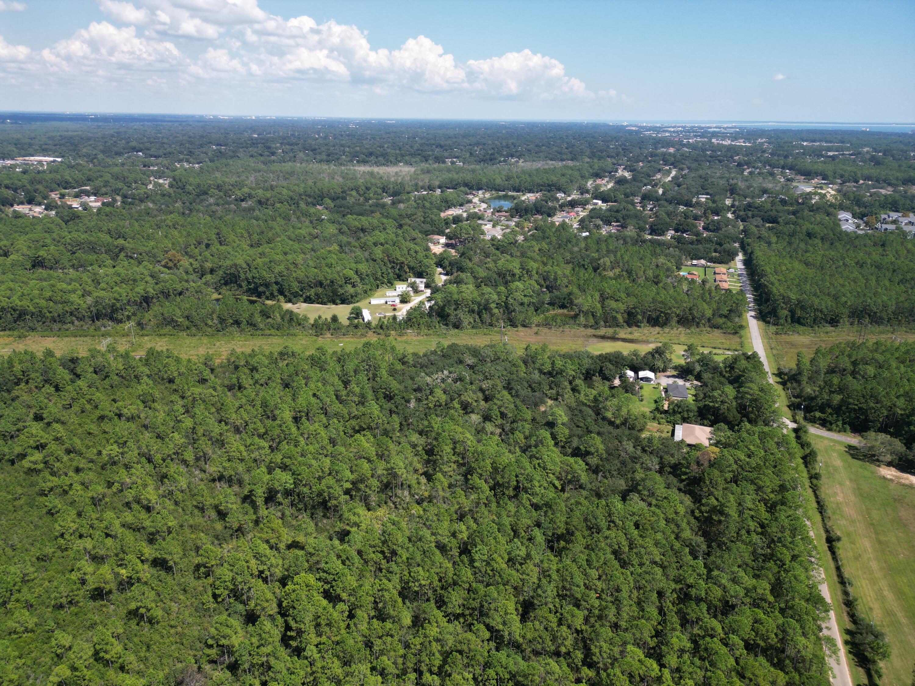 0 Mier Henry Road Pensacola, FL 32506 - Photo 6 of 20 an aerial view of residential houses with outdoor space and trees