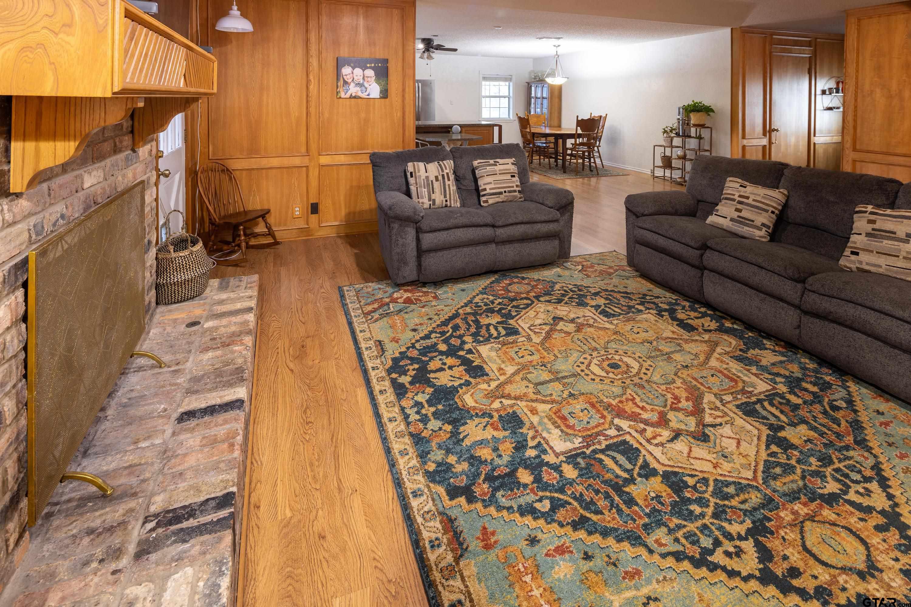 2900 West Azalea Drive Tyler, TX 75701 - Photo 11 of 37 a living room with a couch and a coffee table