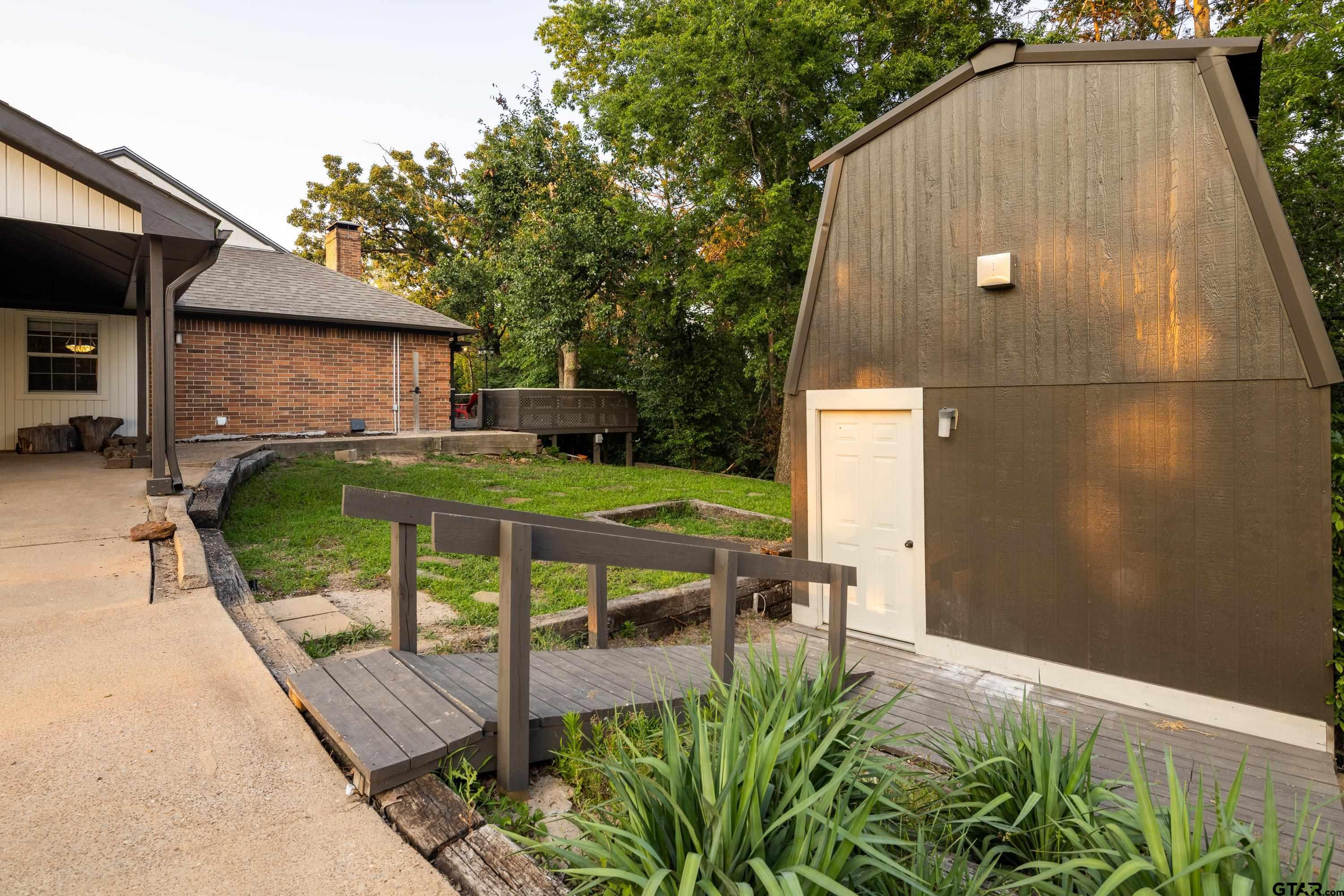 2900 West Azalea Drive Tyler, TX 75701 - Photo 27 of 37 a view of backyard with swimming pool