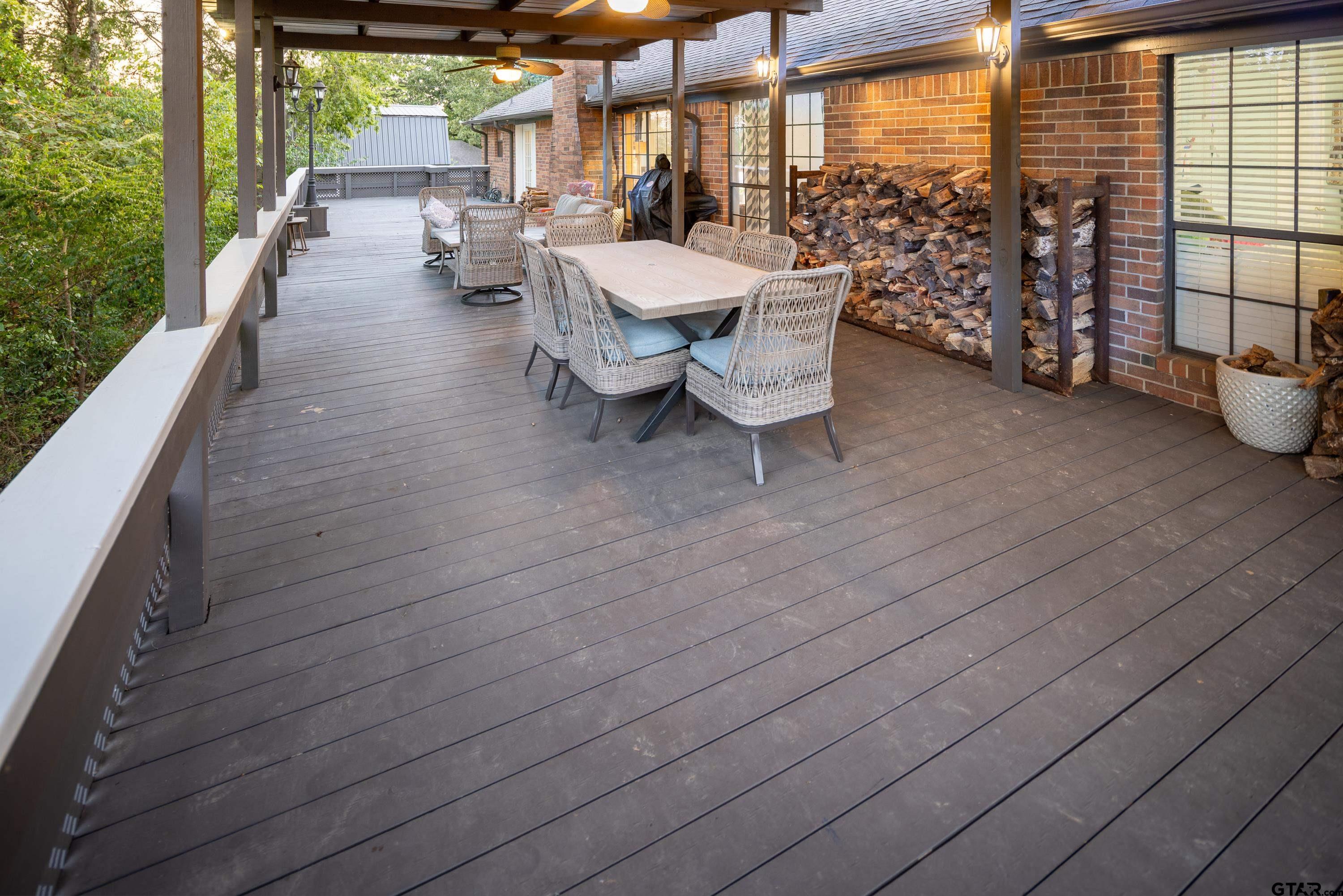 2900 West Azalea Drive Tyler, TX 75701 - Photo 31 of 37 a view of a patio with table and chairs and potted plants