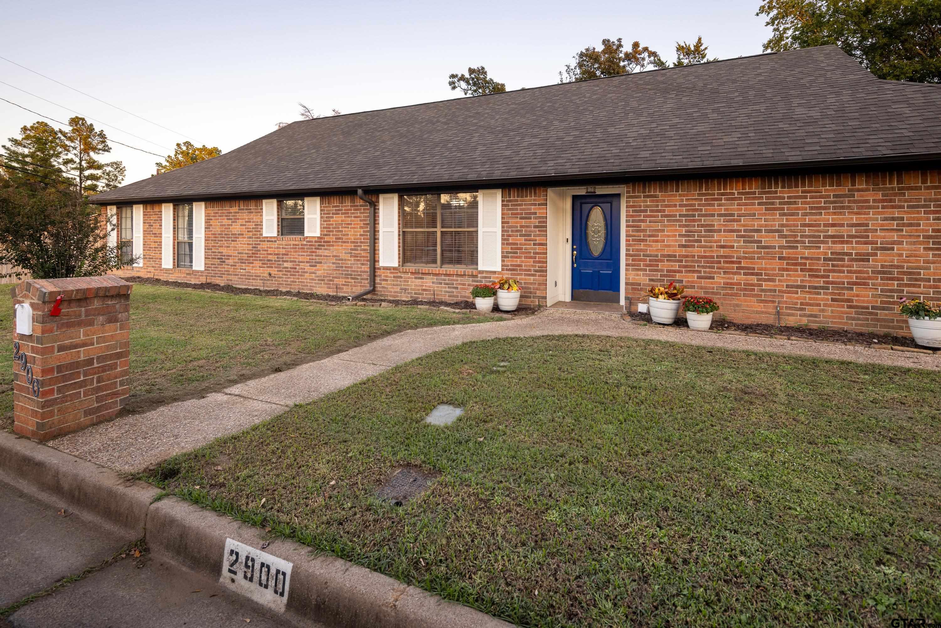 2900 West Azalea Drive Tyler, TX 75701 - Photo 4 of 37 a view of a house with backyard and sitting area
