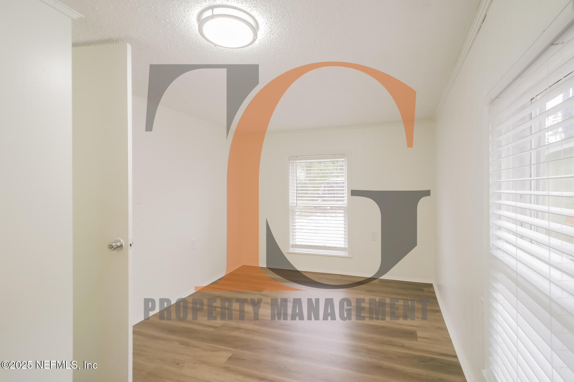 113 Cedar Street St. Augustine, FL 32084 - Photo 5 of 10 a view of entryway with kitchen and wooden floor