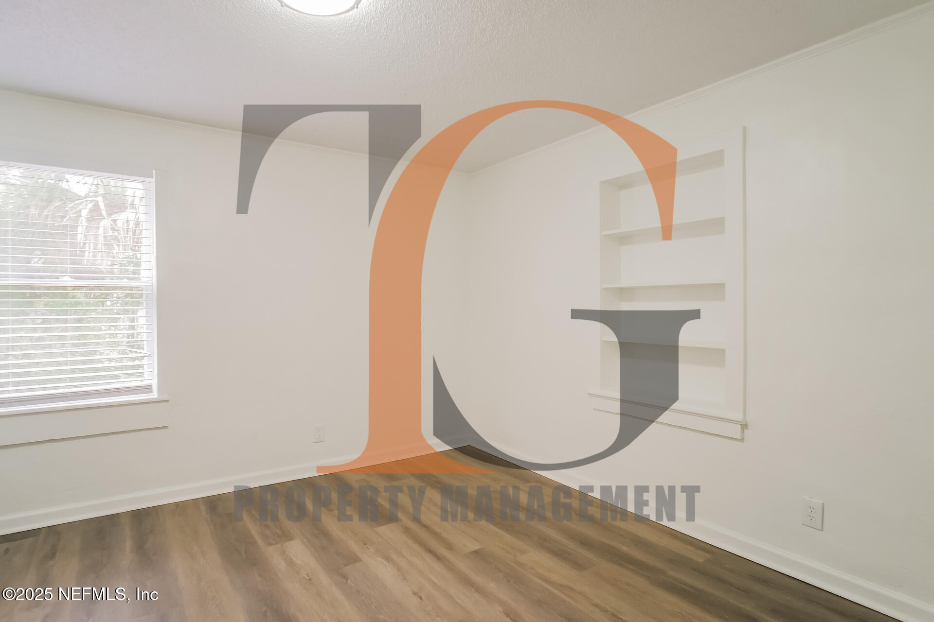 113 Cedar Street St. Augustine, FL 32084 - Photo 6 of 10 a view of a room with wooden floor and windows