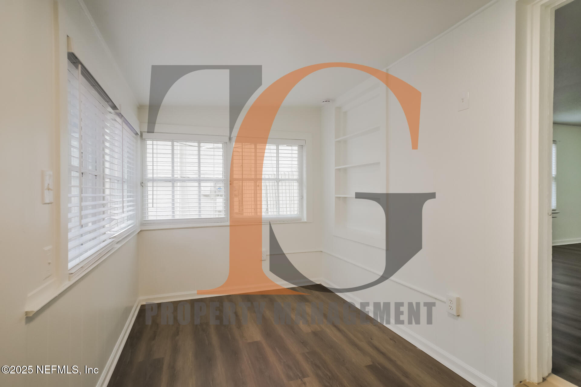 113 Cedar Street St. Augustine, FL 32084 - Photo 9 of 10 a view of empty room with wooden floor and fan