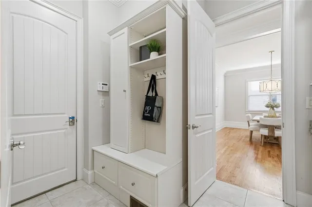 a kitchen with granite countertop a stove a sink dishwasher a refrigerator and wooden cabinets with wooden floor