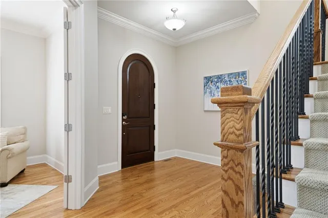 a view of a bedroom with wooden floor cabinet and a bathroom