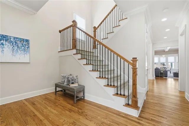 a view of entryway and hall with wooden floor