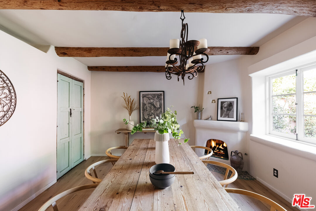4342 Bakman Avenue Studio City, CA 91602 - Photo 14 of 31 a table and a vase of flowers sitting on a table