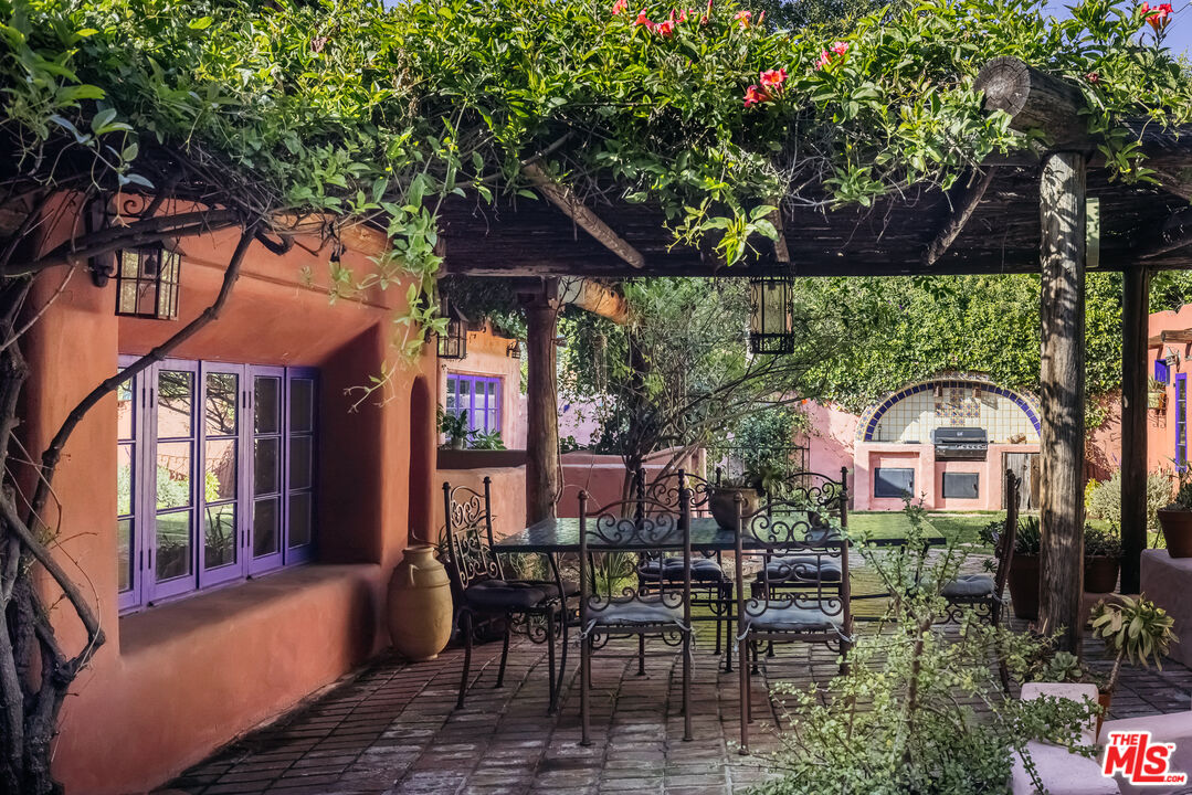4342 Bakman Avenue Studio City, CA 91602 - Photo 23 of 31 a view of a chairs and table in the patio