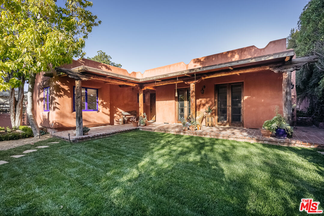 4342 Bakman Avenue Studio City, CA 91602 - Photo 29 of 31 a view of a chair and table of back yard of the house