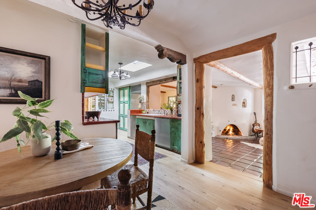 4342 Bakman Avenue Studio City, CA 91602 - Photo 8 of 31 a view of a dining room with furniture and a flat screen tv