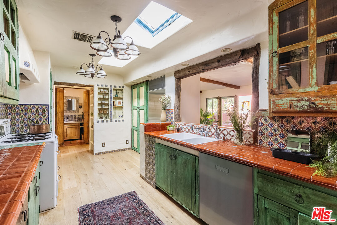4342 Bakman Avenue Studio City, CA 91602 - Photo 10 of 31 a view of a living room and kitchen with a large window