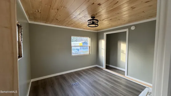 a view of room with wooden floor