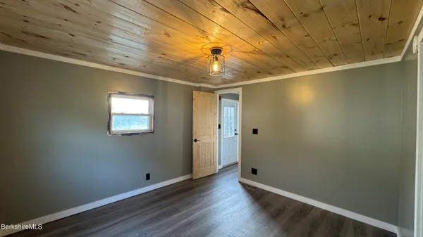 a view of front door with wooden floor