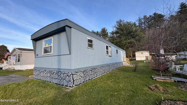 a view of a backyard of the house