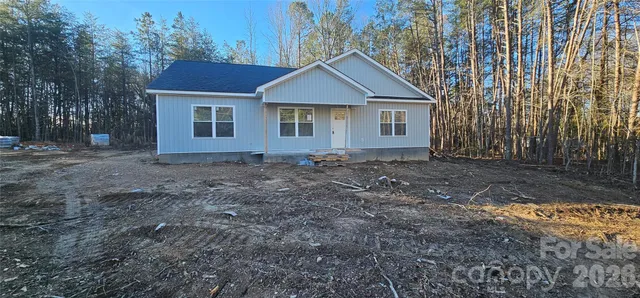 a house with trees in the background