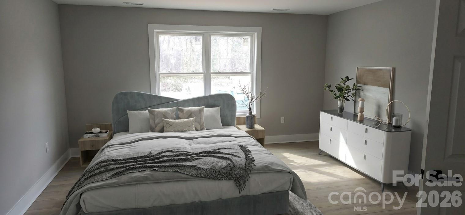 294 Zion Church Road Clover, SC 29710 - Photo 15 of 20 a spacious bedroom with a bed and a window