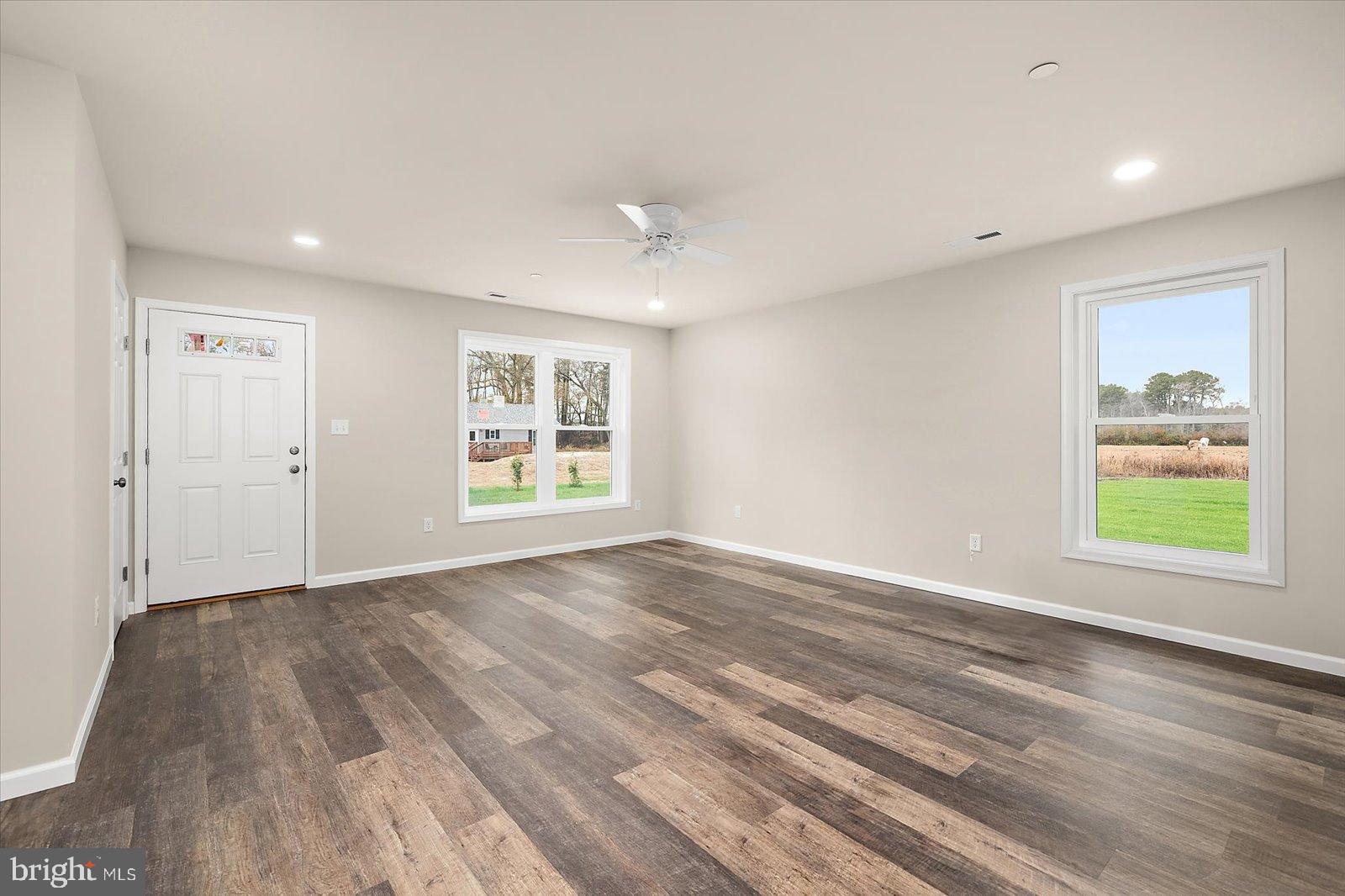 3963 Disharoon Road Eden, MD 21822 - Photo 11 of 61 a view of an empty room with a window and wooden floor
