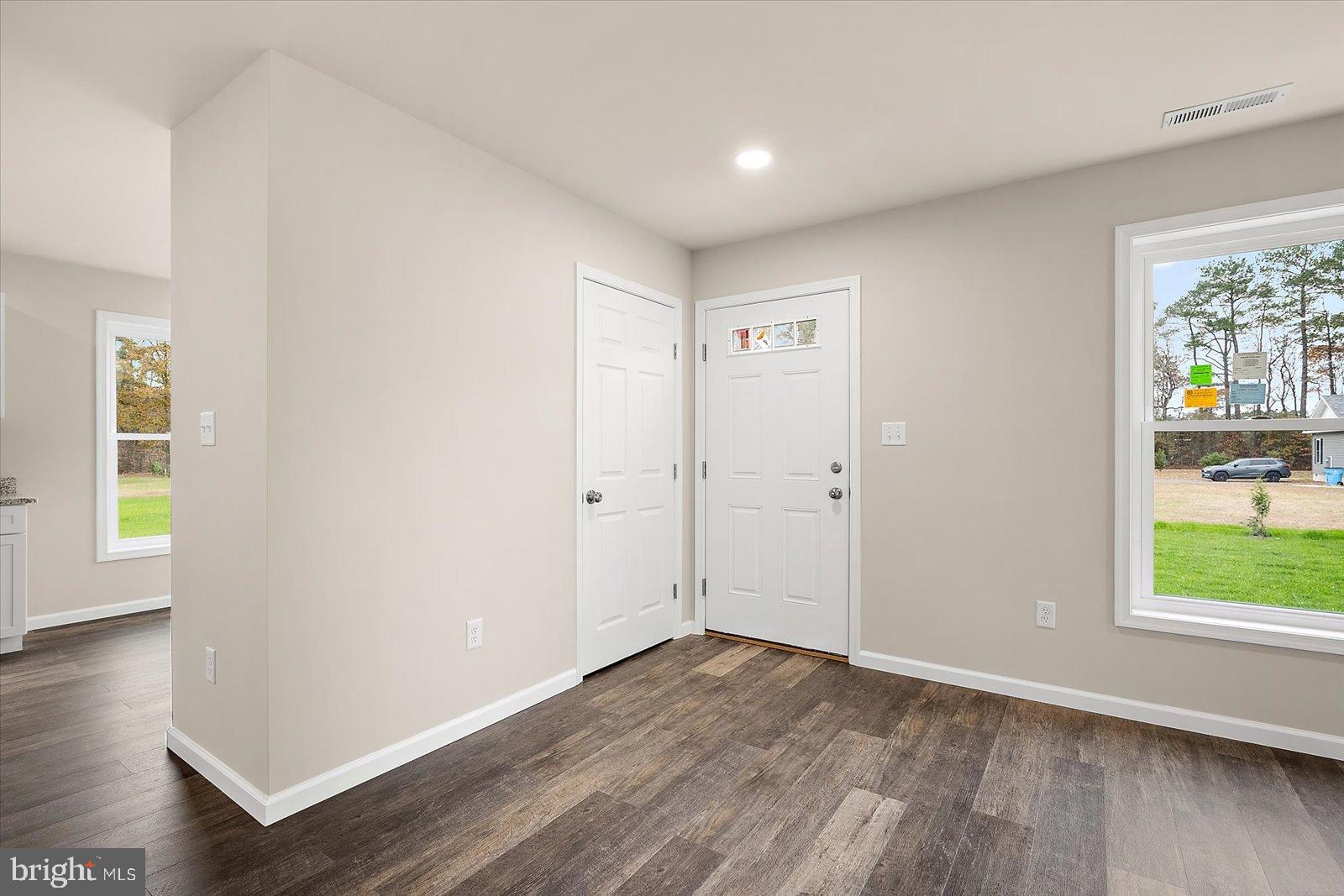 3963 Disharoon Road Eden, MD 21822 - Photo 12 of 61 an empty room with wooden floor and windows