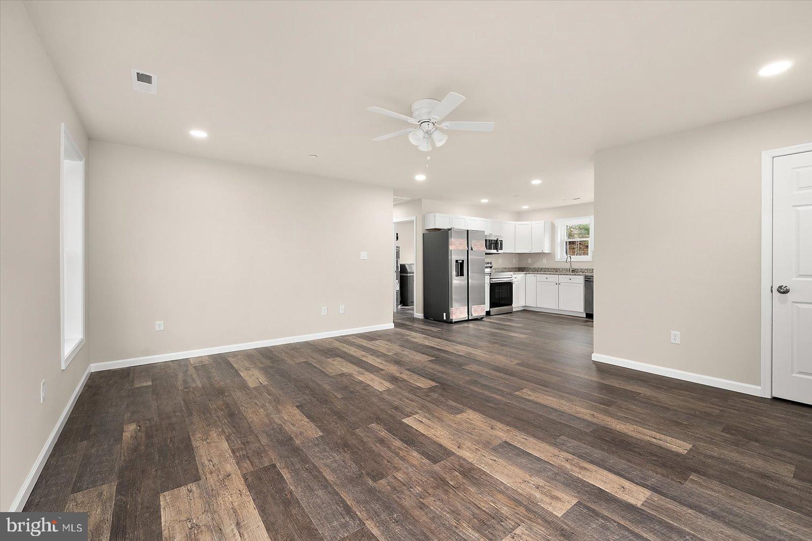 3963 Disharoon Road Eden, MD 21822 - Photo 14 of 61 a view of kitchen with refrigerator stove and wooden floor