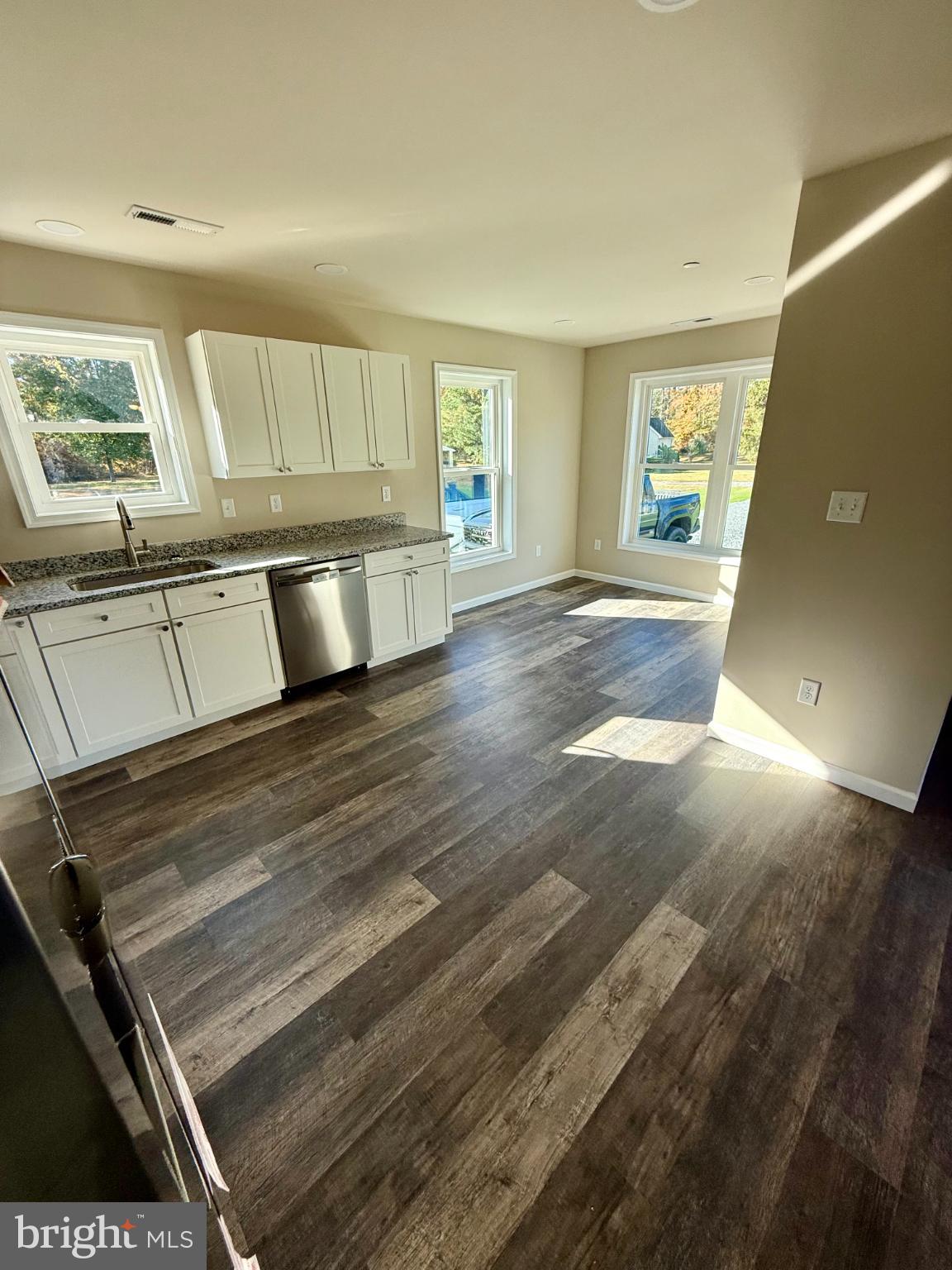 3963 Disharoon Road Eden, MD 21822 - Photo 22 of 61 a view of an empty room with wooden floor and a window
