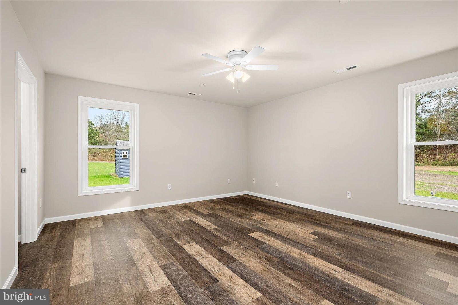 3963 Disharoon Road Eden, MD 21822 - Photo 26 of 61 a view of an empty room with wooden floor and a window