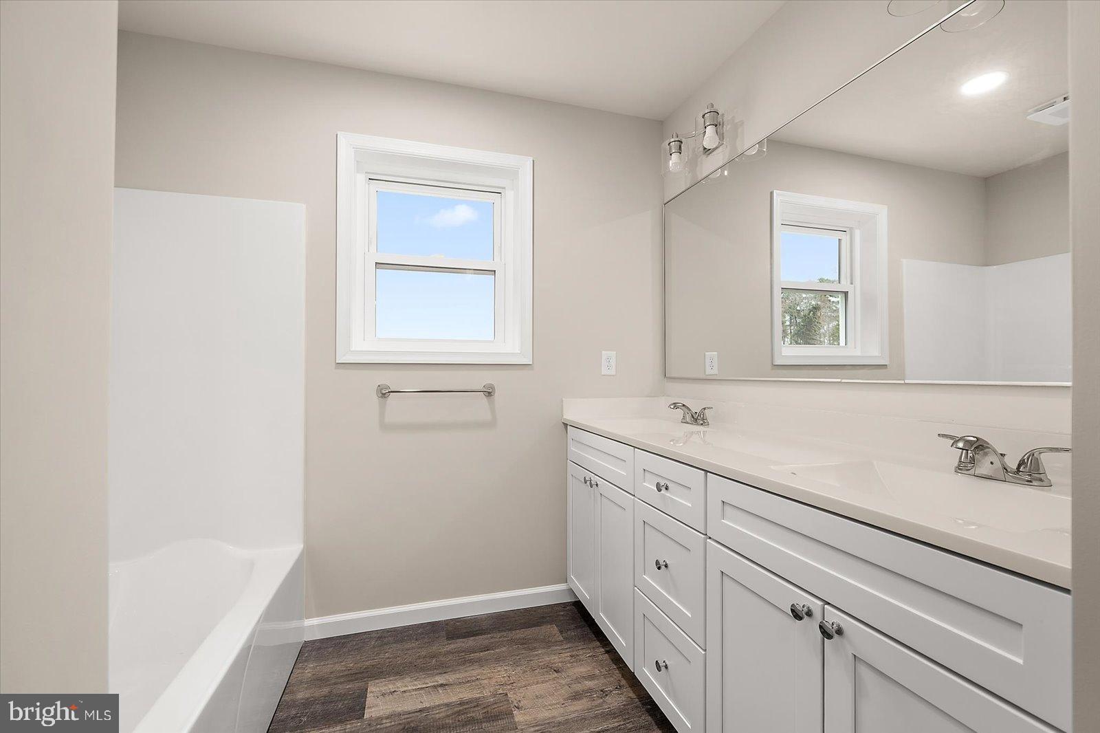 3963 Disharoon Road Eden, MD 21822 - Photo 30 of 61 a bathroom with a sink a mirror and a window