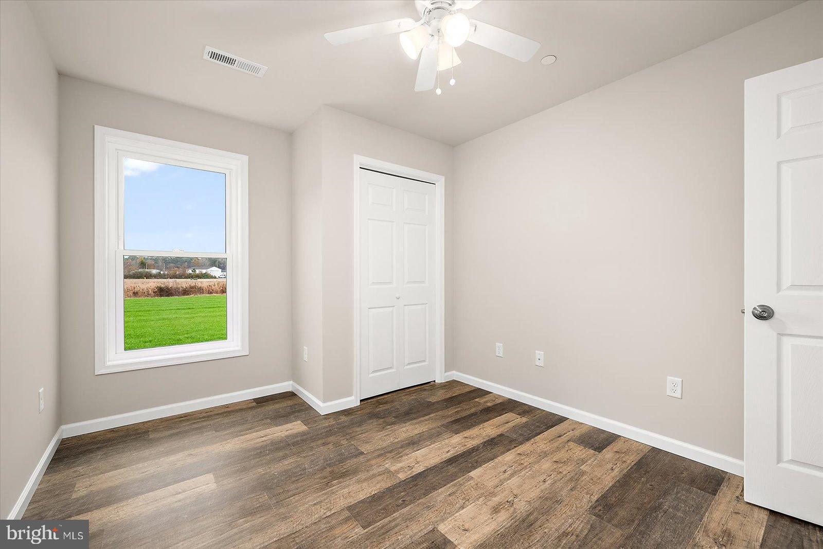 3963 Disharoon Road Eden, MD 21822 - Photo 33 of 61 a view of an empty room with wooden floor and a window