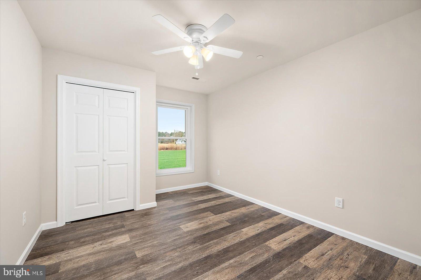 3963 Disharoon Road Eden, MD 21822 - Photo 37 of 61 an empty room with a windows and ceiling fan