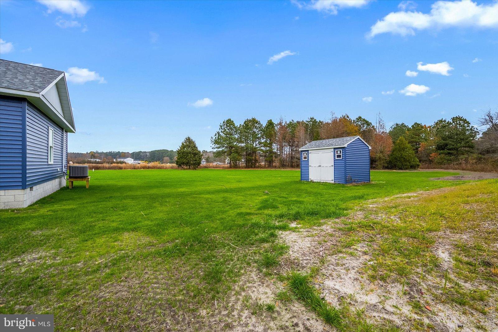 3963 Disharoon Road Eden, MD 21822 - Photo 44 of 61 a view of a garden with a building in the background
