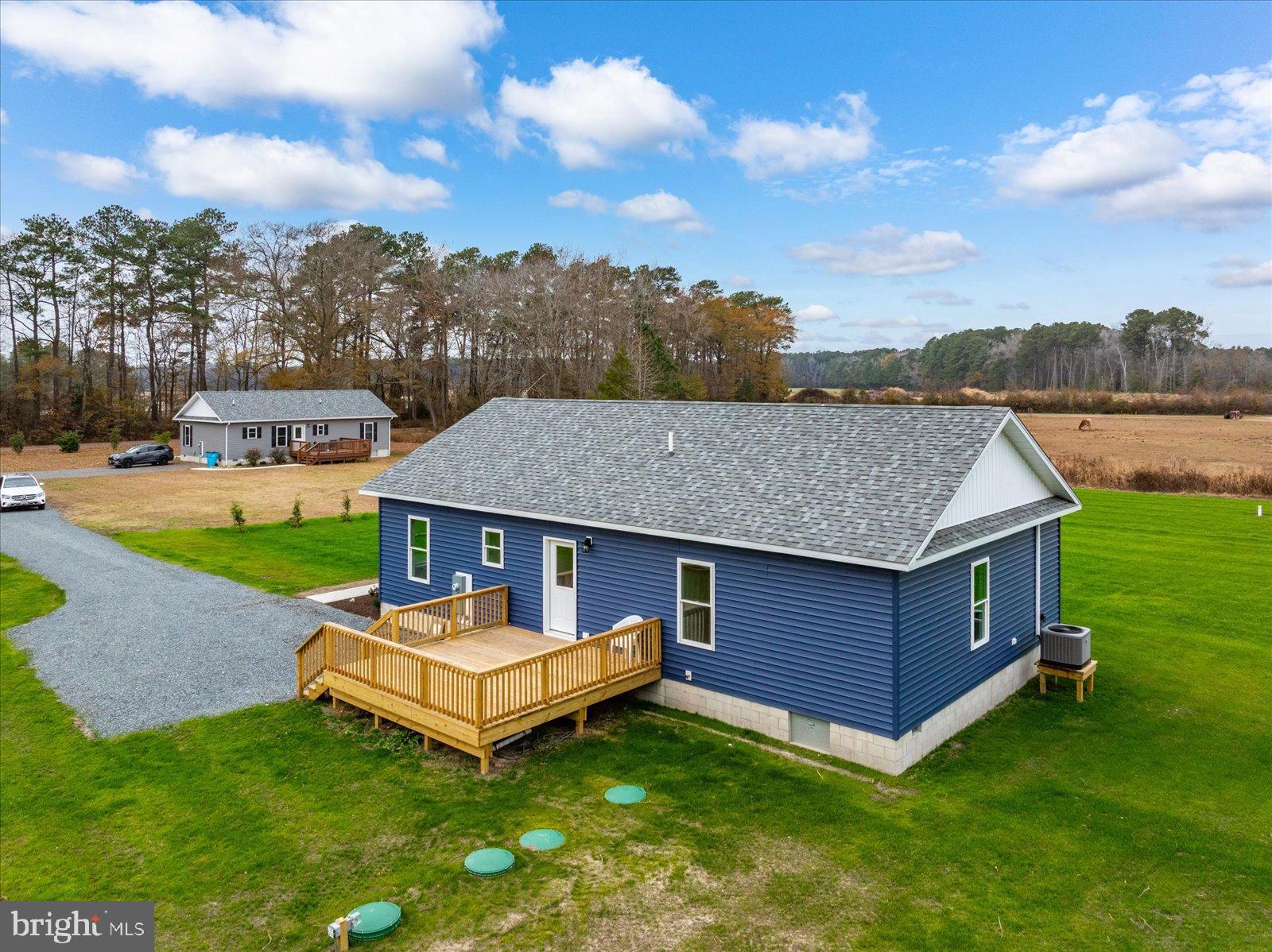 3963 Disharoon Road Eden, MD 21822 - Photo 49 of 61 a backyard of a house with table and chairs