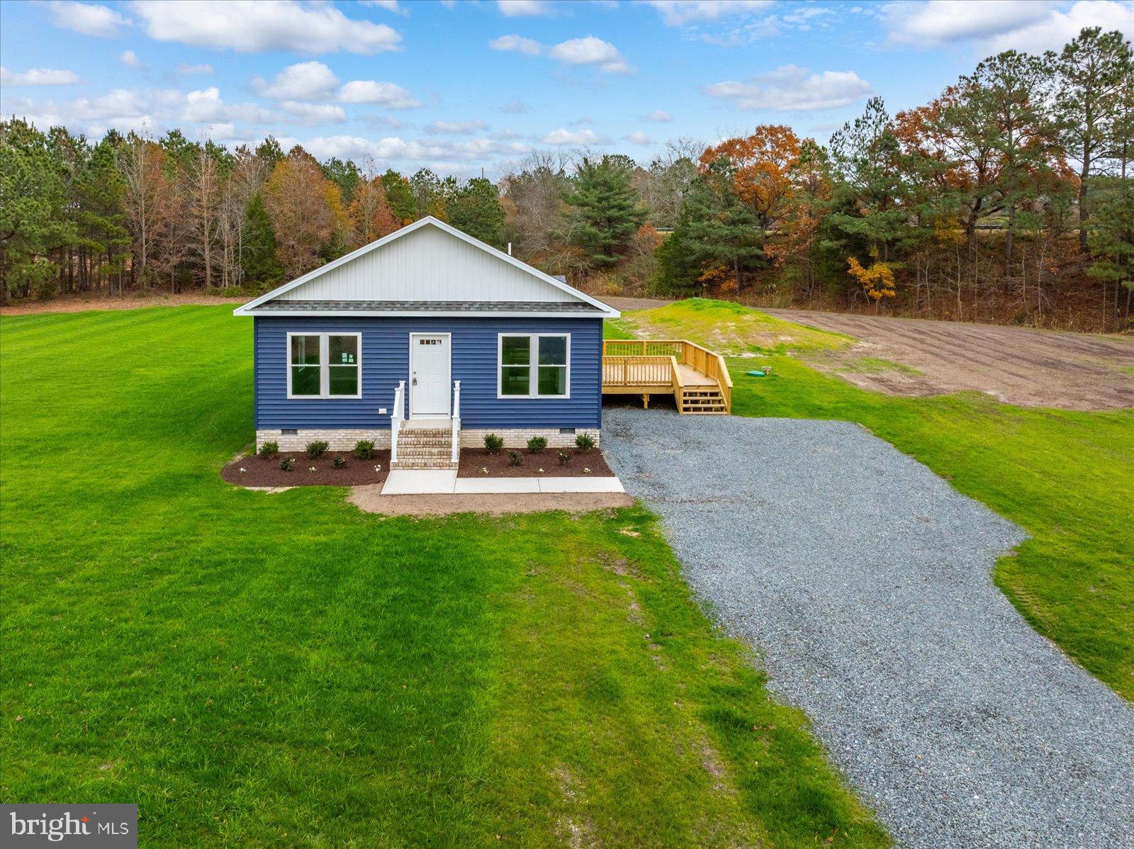 3963 Disharoon Road Eden, MD 21822 - Photo 6 of 61 a front view of a house with garden