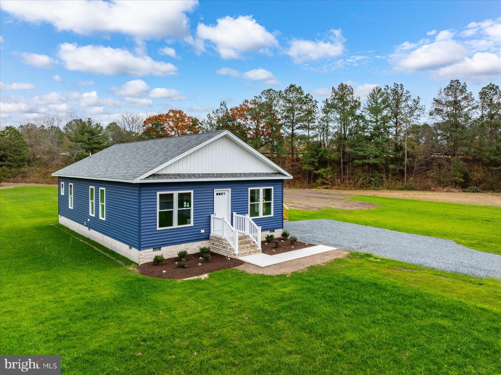 3963 Disharoon Road Eden, MD 21822 - Photo 7 of 61 a view of a house with a yard table and chairs