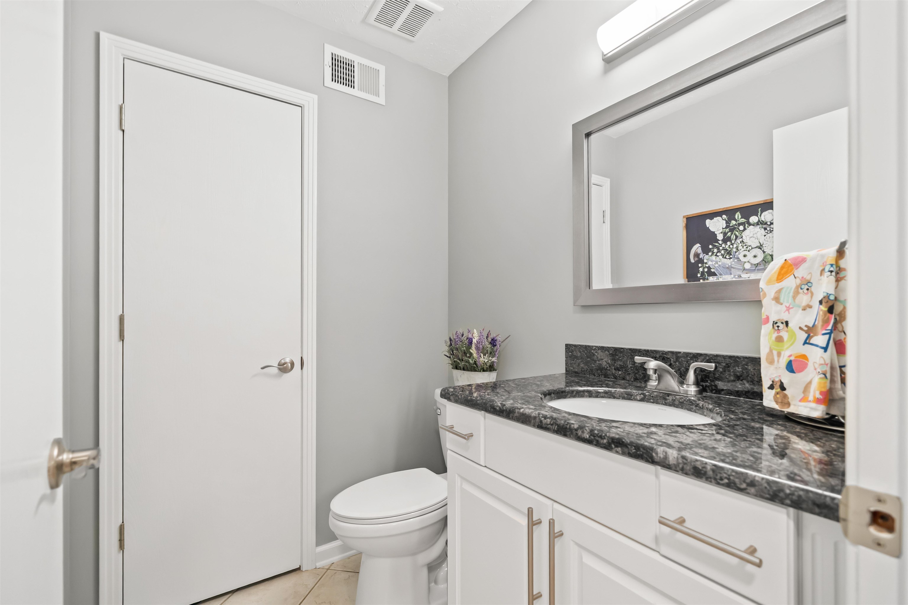 6943 Fords Station Road, Unit 64 Germantown, TN 38138 - Photo 13 of 30 Bathroom vanity featuring a dark stone countertop with an undermount sink and chrome fixtures
