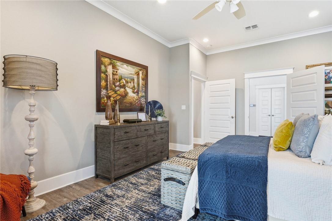 12 Sea Shell Shores Rockport, TX 78382 - Photo 15 of 40 a bedroom with a bed and wooden floor