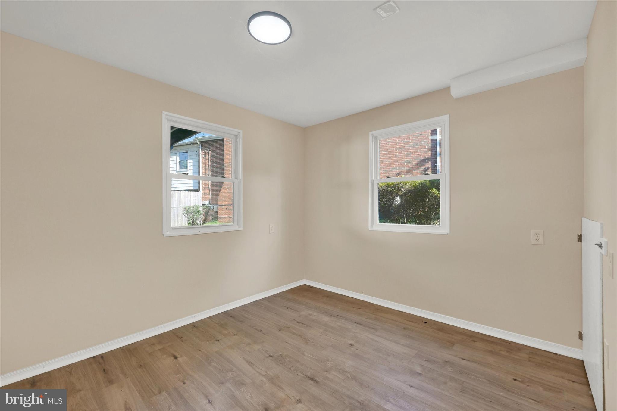 8577 Main Avenue Pasadena, MD 21122 - Photo 15 of 19 an empty room with a window