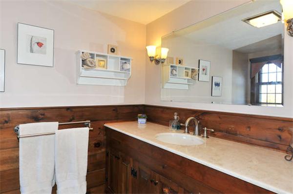 37 Sampson Road Bolton, MA 01740 - Photo 16 of 29 a bathroom with a sink and a mirror