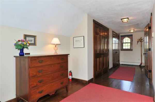37 Sampson Road Bolton, MA 01740 - Photo 17 of 29 a hallway with a dresser