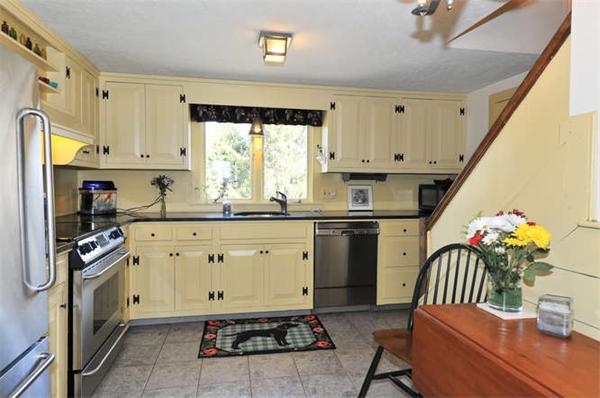 37 Sampson Road Bolton, MA 01740 - Photo 6 of 29 a kitchen with granite countertop a stove sink and cabinets