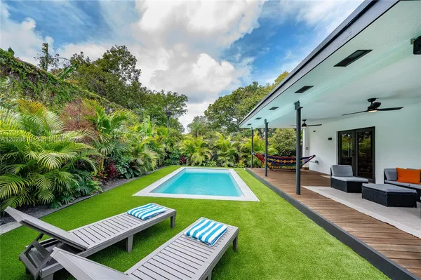 a view of swimming pool with lounge chair