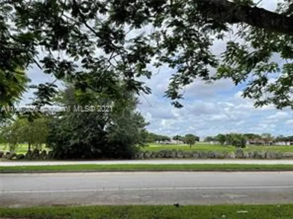 a view of a golf course with a lake