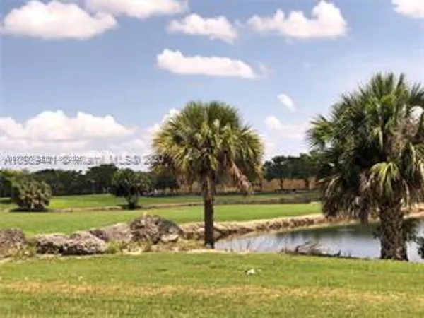 a view of a lake with a yard