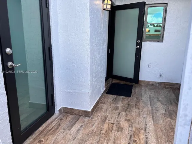 a bathroom with a sink and shower